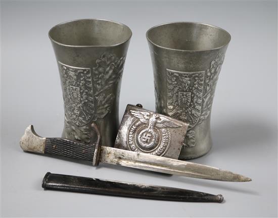 Two pewter armorial cups and a dagger